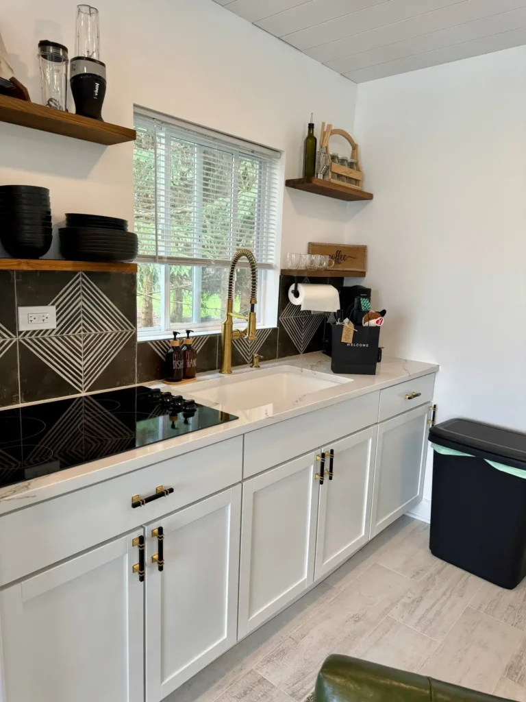 White kitchen with gold and black hardware. Kitchen remodeling.