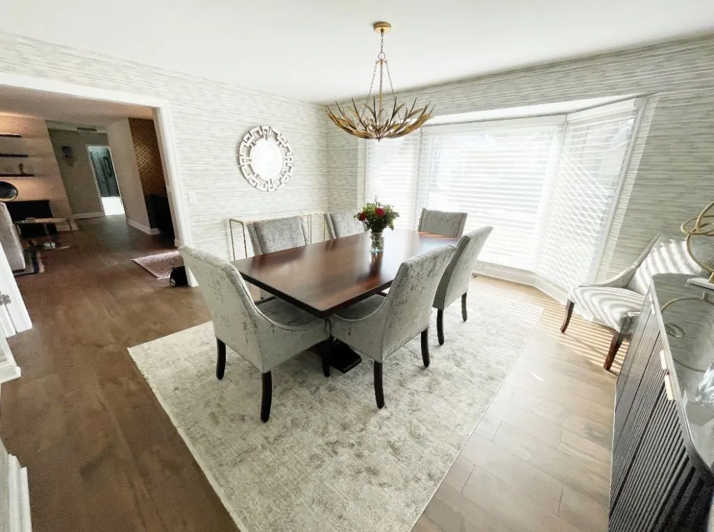 Beautiful dining room with modern chandelier. Home remodeling contractor in Oswego, Illinois.