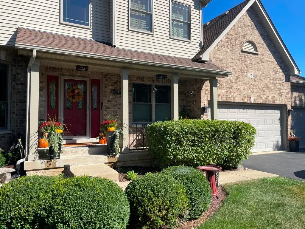 Attractive home exterior with porch. Home improvement services.