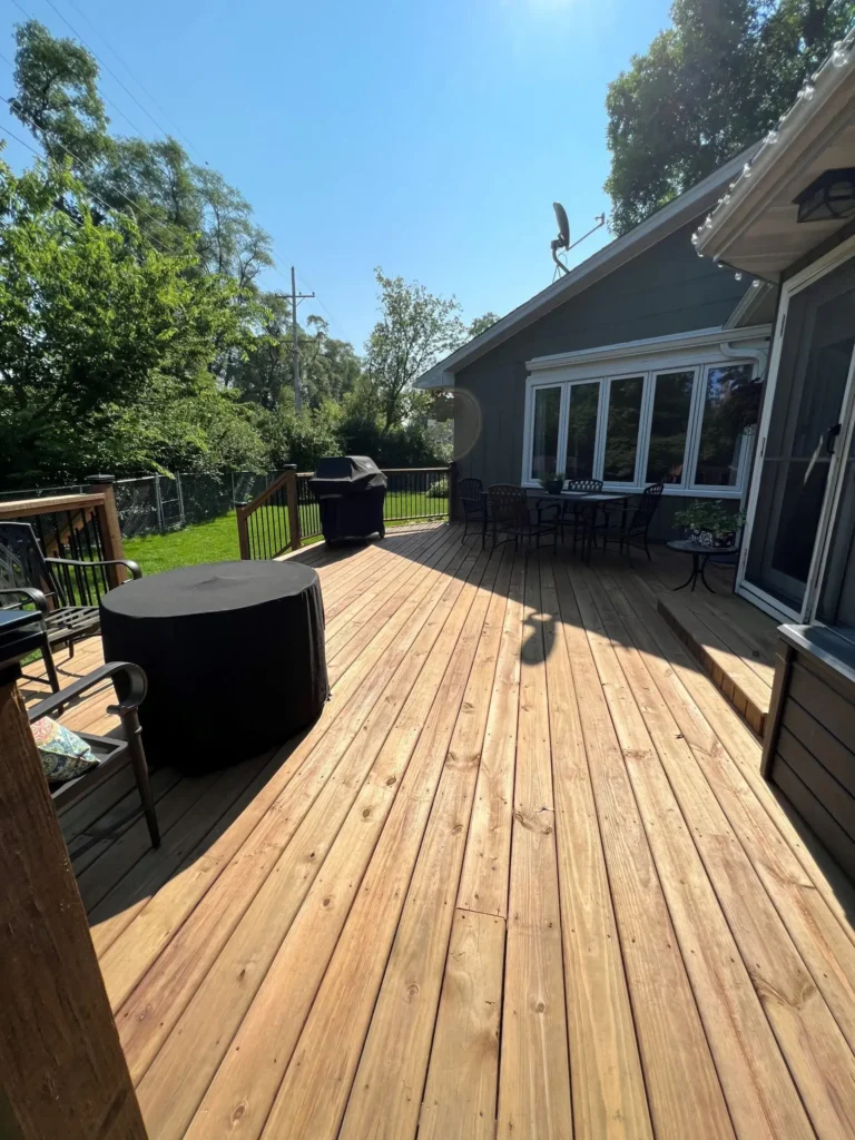 Large wooden deck for outdoor living. Deck builders in Oswego, Illinois.