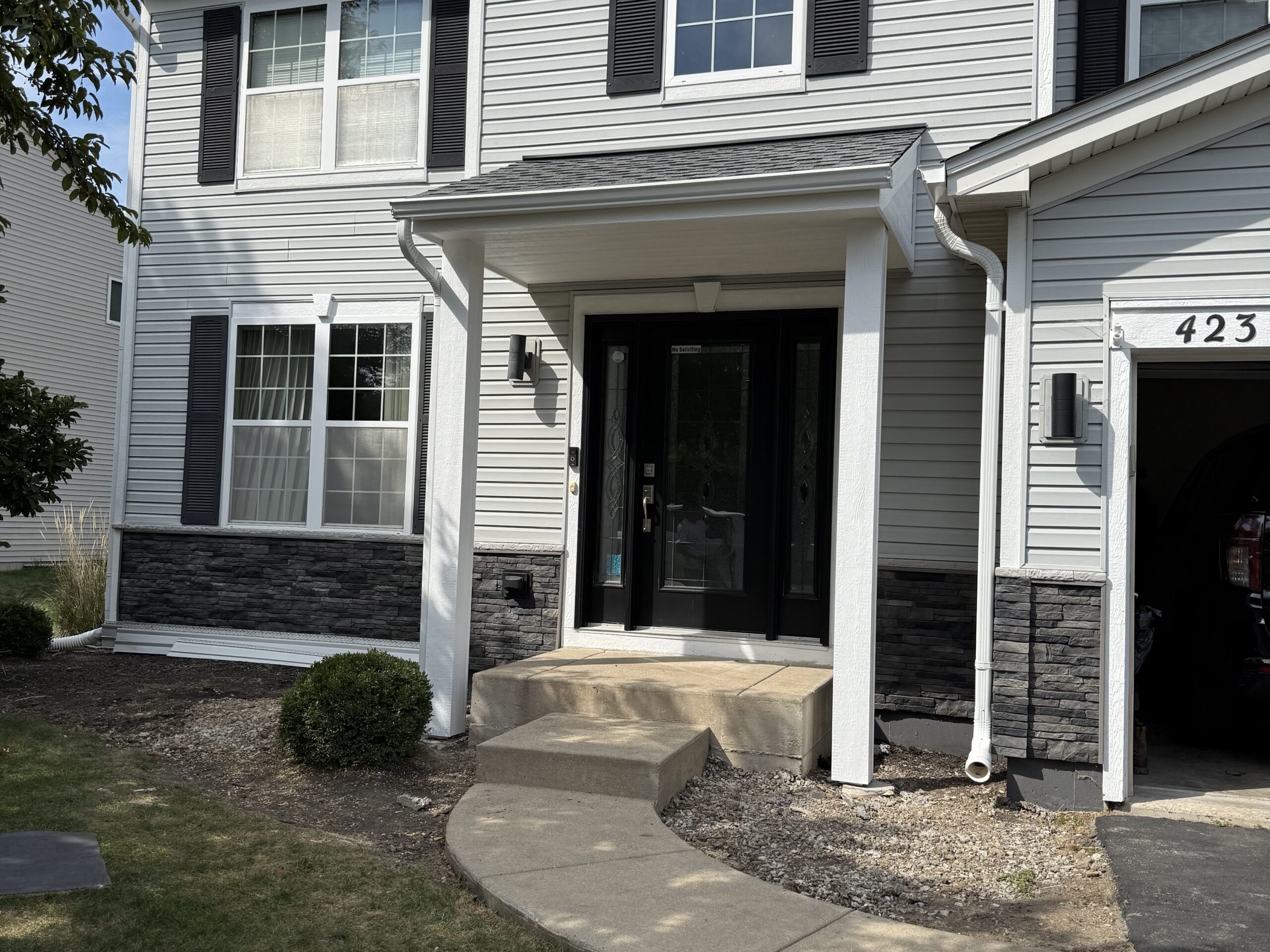 Fully covered porch with roof structure in Yorkville, IL, featuring custom craftsmanship for outdoor living.