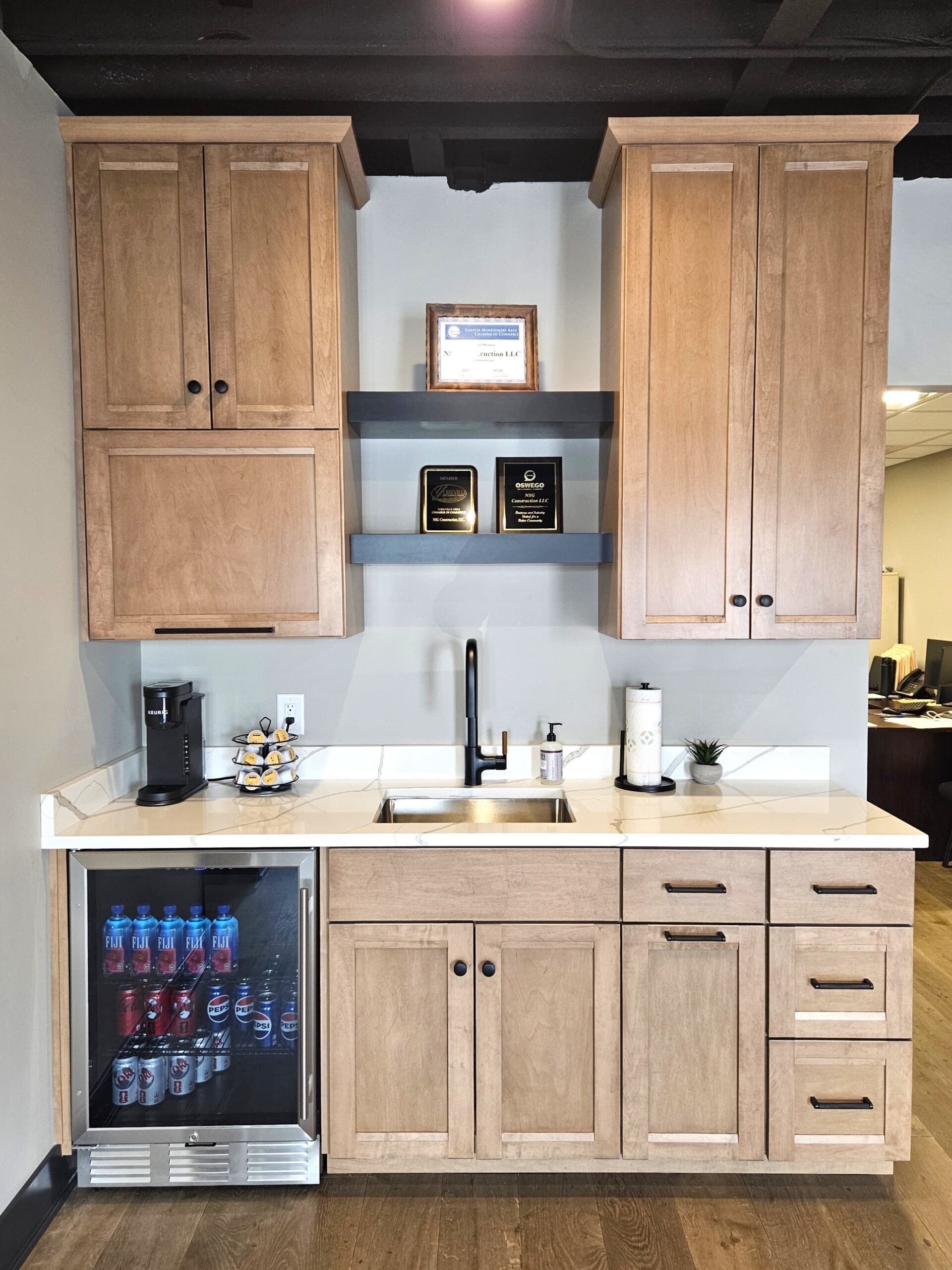 NSG Construction showroom featuring a custom kitchenette display