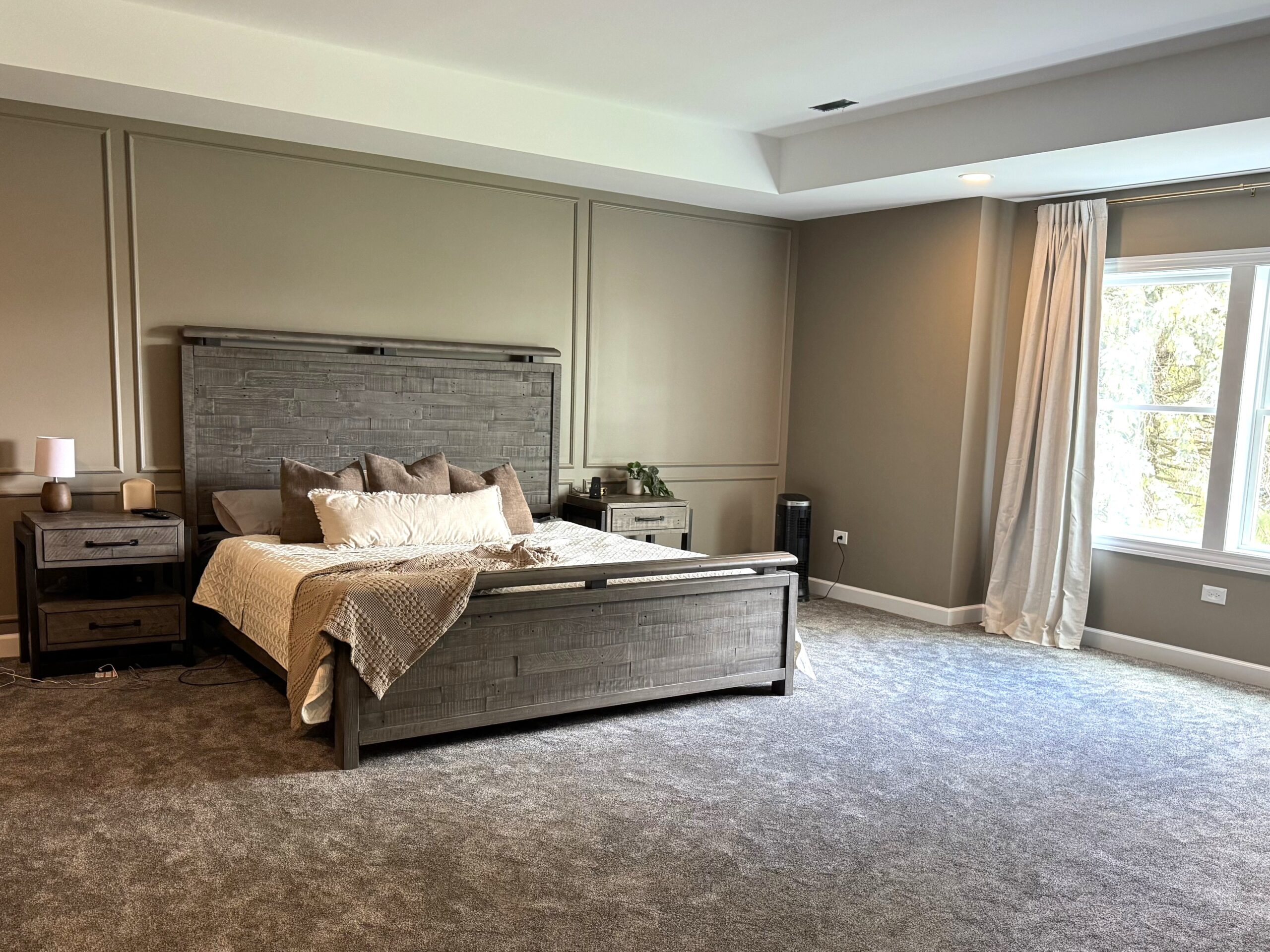 Custom bedroom addition in Somonauk, IL featuring a neutral color palette and rustic-inspired design.